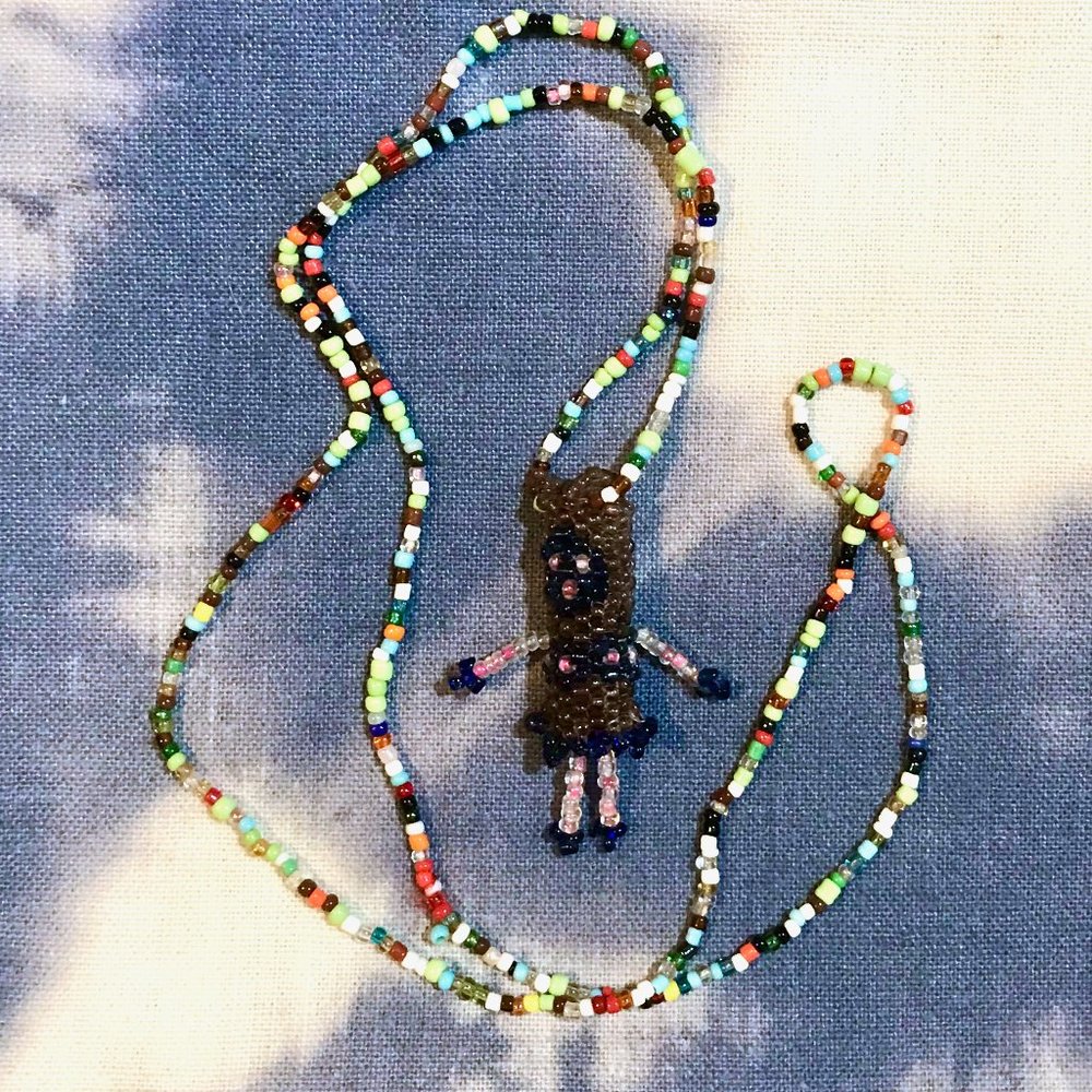 beaded doll necklace